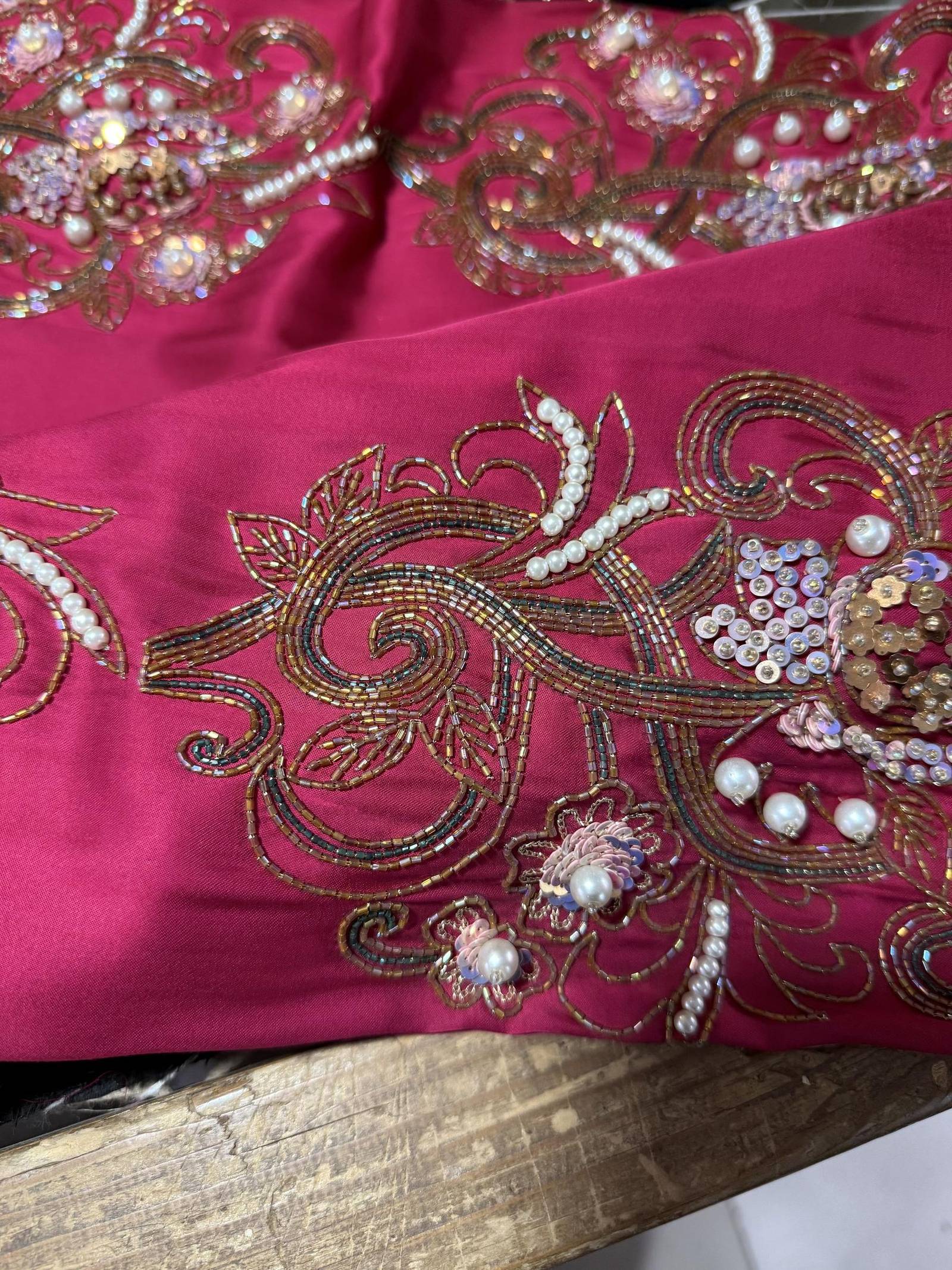 Macro detail of hand embroidery in soft pink tones, Lolo by Laila